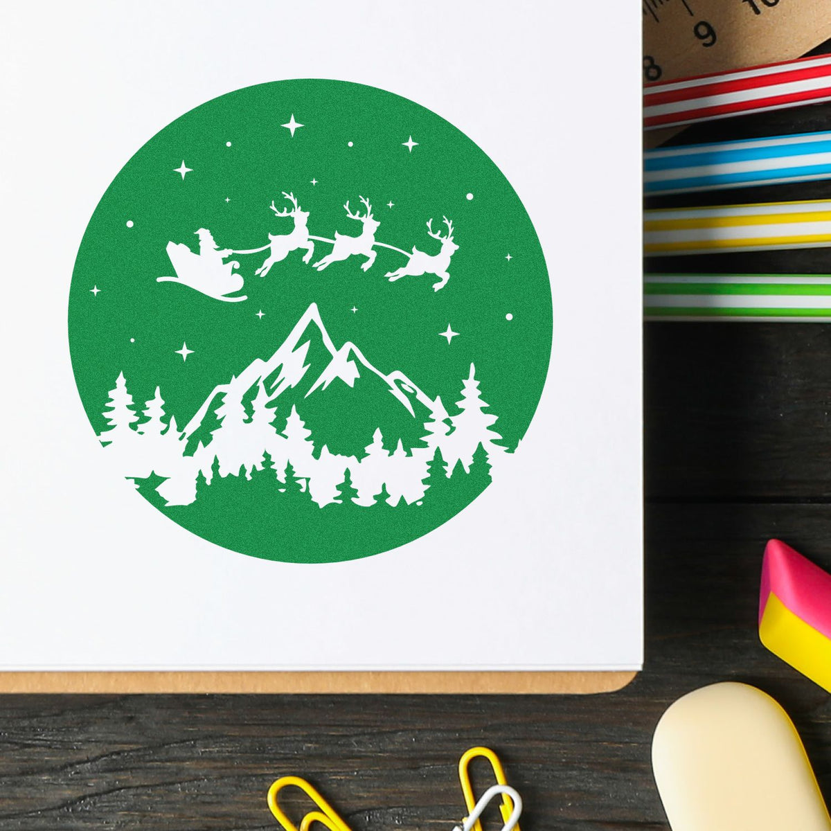 Santa Sleigh Mountain Night rubber stamp shown in green ink, stamped for projects such as night scene album.