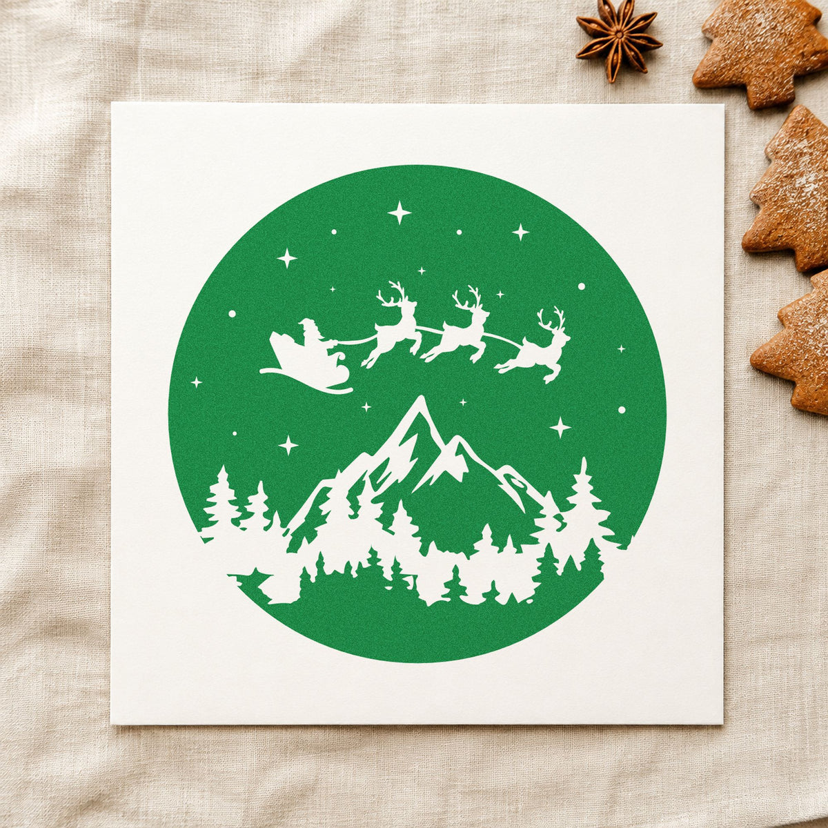 Santa Sleigh Mountain Night craft stamp imprint in green ink on a handmade project, one idea being disc ornament tags.