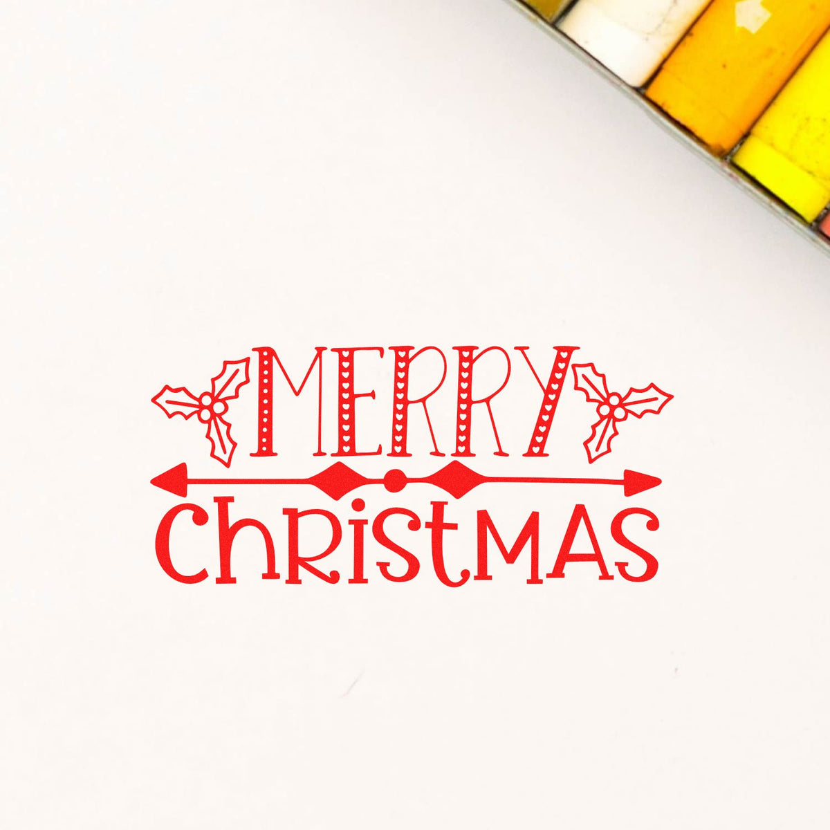 Merry Christmas rubber stamp design in red with holly accents, perfect for holiday card making and festive paper crafts.