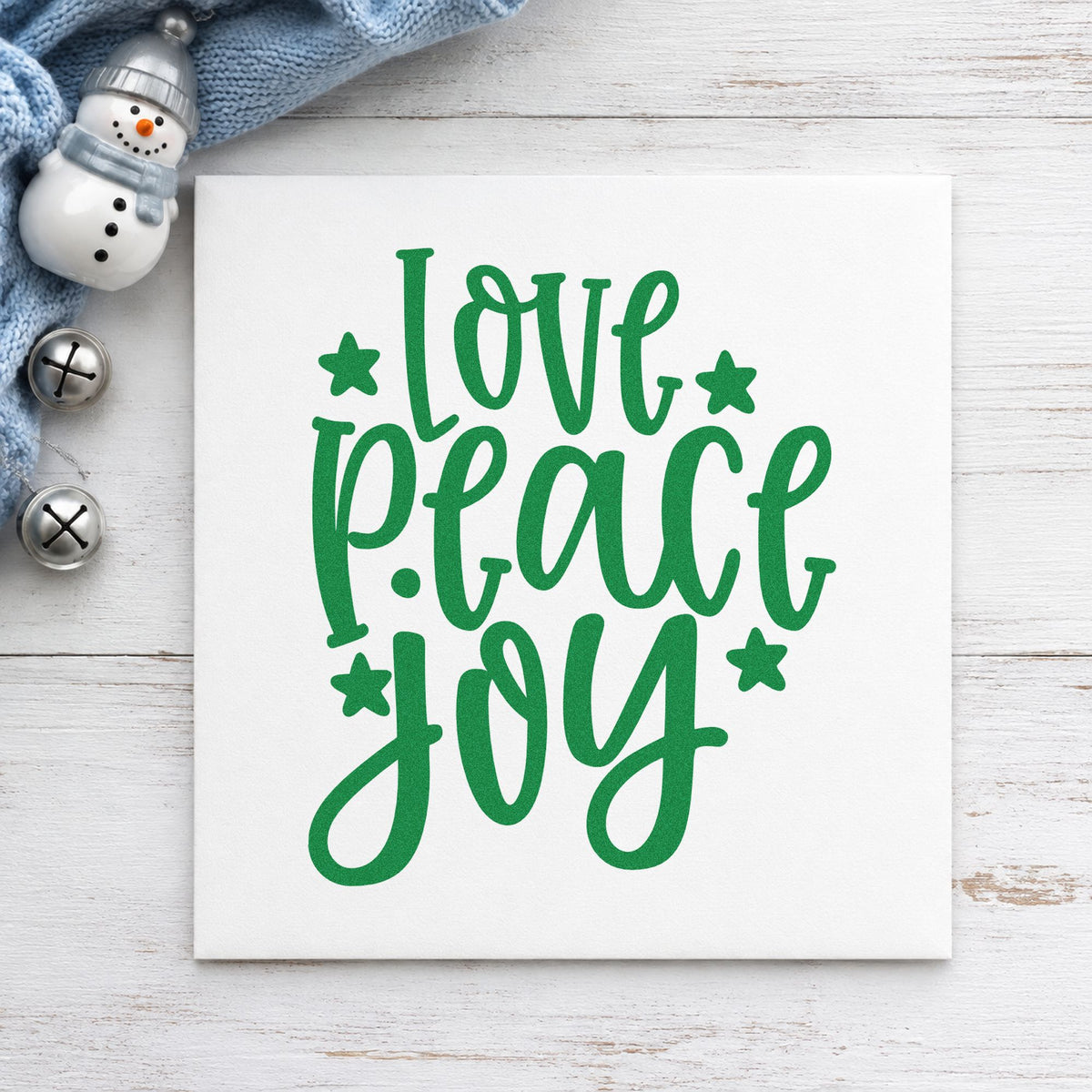 Love Peace Joy Stars craft stamp imprinted in green ink on paper, a design suited to framed tall print.