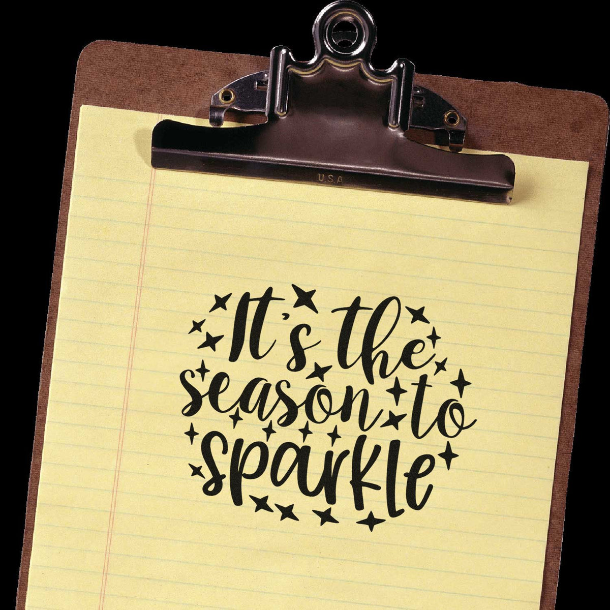 Christmas rubber stamp design reading Its the season to sparkle with star accents on a clipboard.