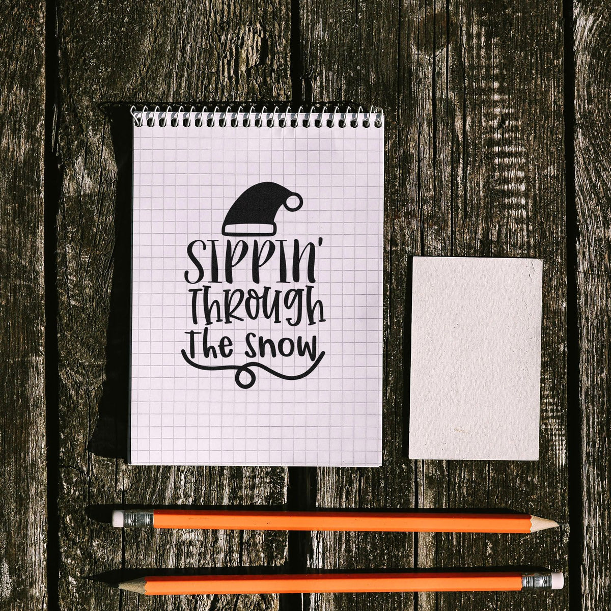 Sippin' Through The Snow Hat Pre-Inked Stamp – PSI imprint stamped in black ink. The words "Sippin' through the snow" appear beneath a Santa hat with a looping underline.