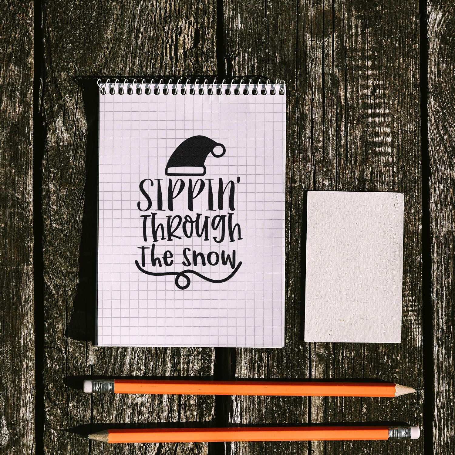 Holiday rubber stamp design with Santa hat and Sippin Through the Snow lettering for Christmas crafting.