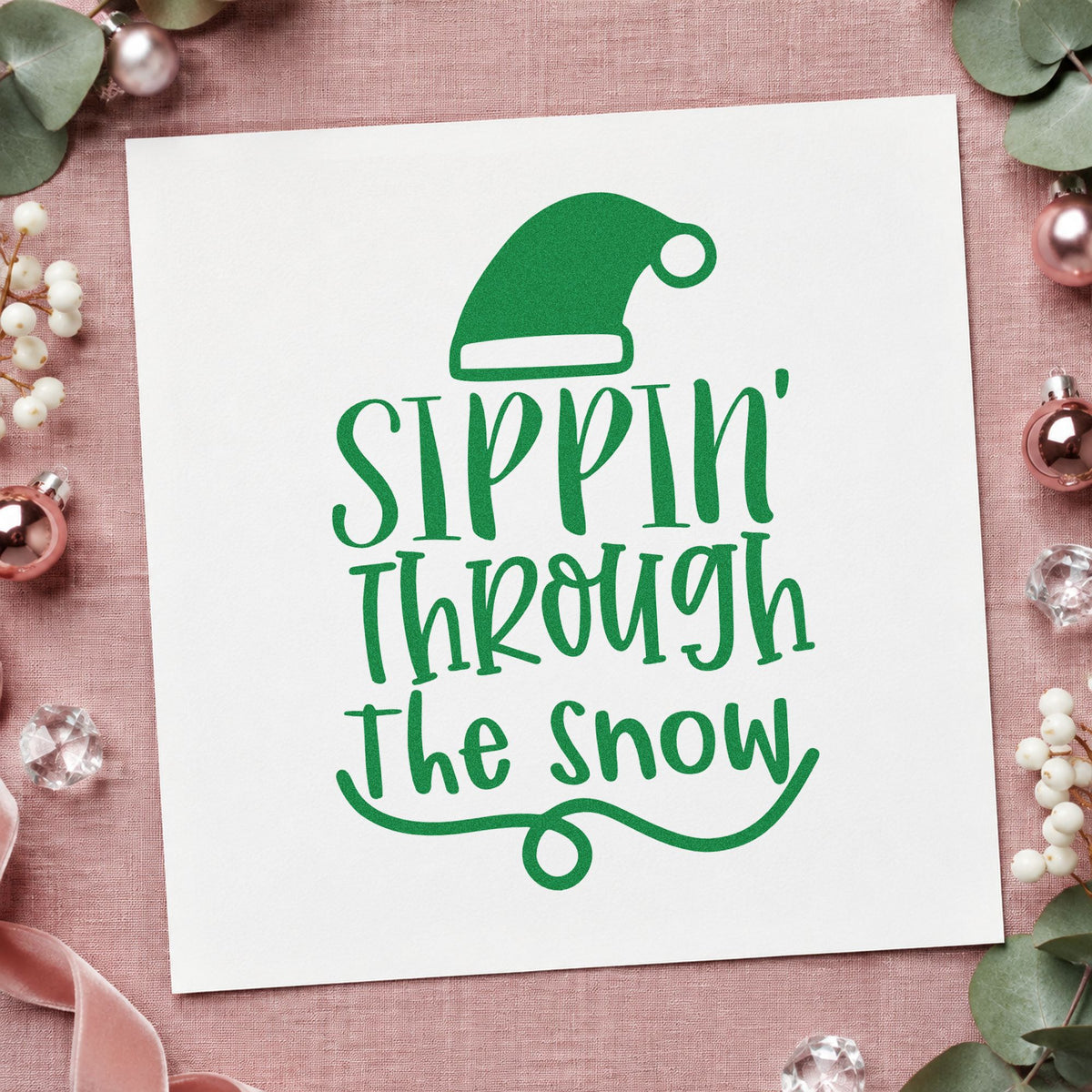 Sippin Through The Snow craft stamp imprint in green ink on a handmade project, one idea being drink menu cards.