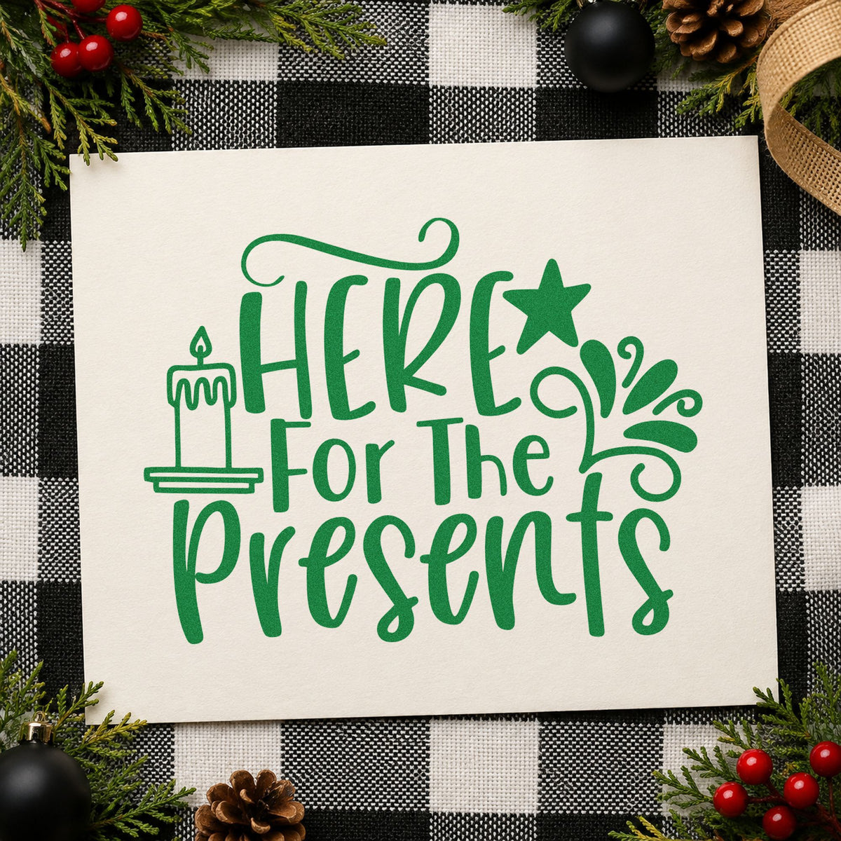 Here For The Presents craft stamp imprinted in green ink on paper, a design suited to framed gift corner.