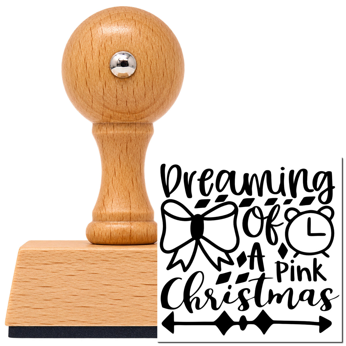 Dreaming Of A Pink Christmas Vintage Pro rubber stamp in European beech wood with a round knob handle, shown beside its black imprint.
