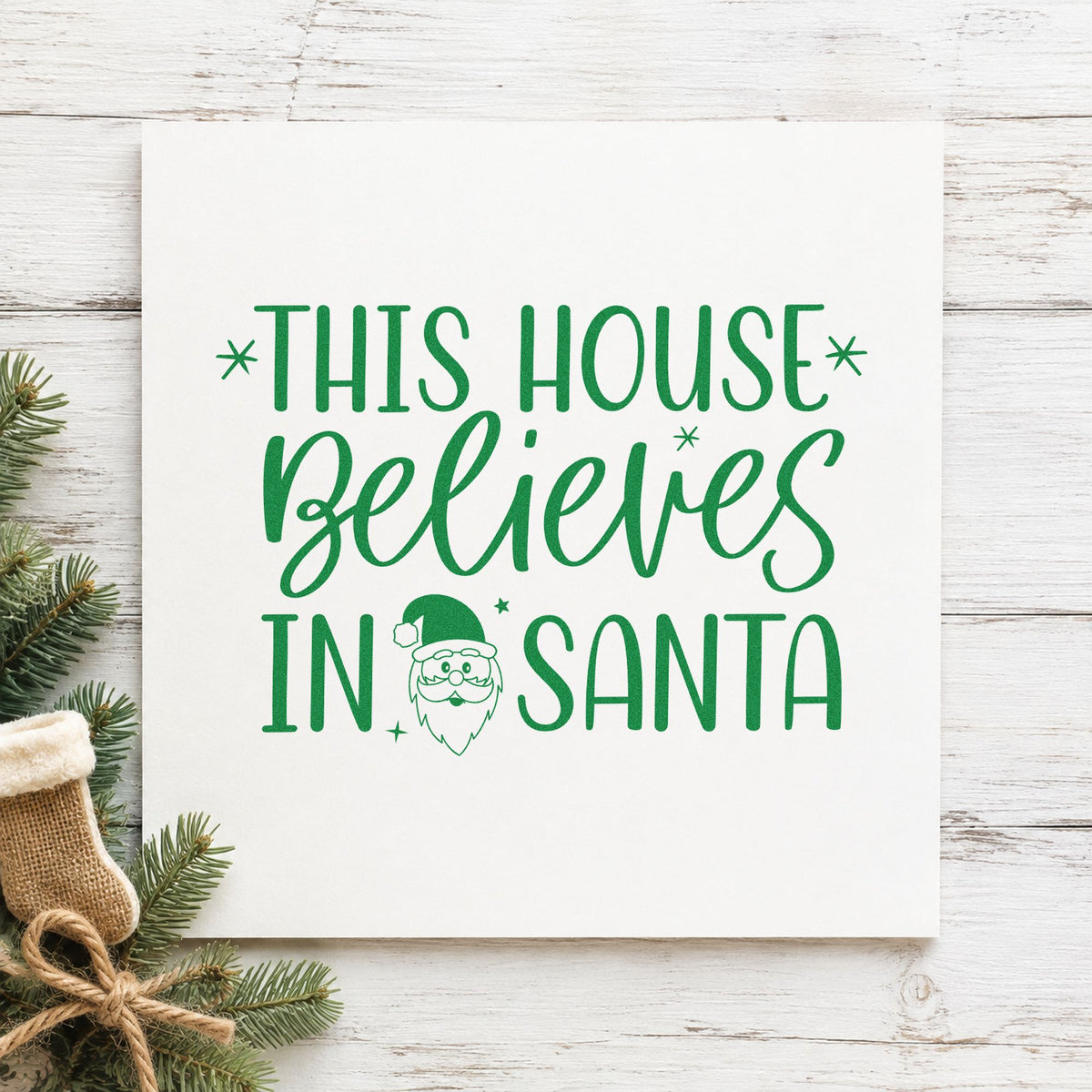 This House Believes In Santa craft stamp imprinted in green ink on paper, a design suited to framed porch post.