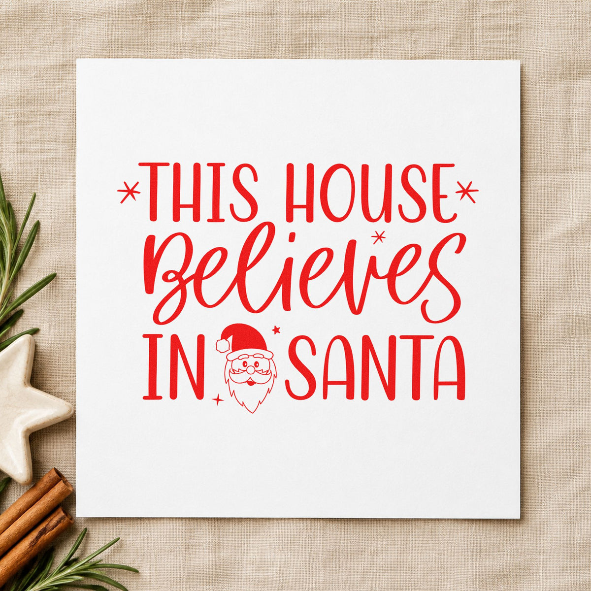 This House Believes In Santa rubber stamp shown in red ink, stamped for projects such as light bin labels.