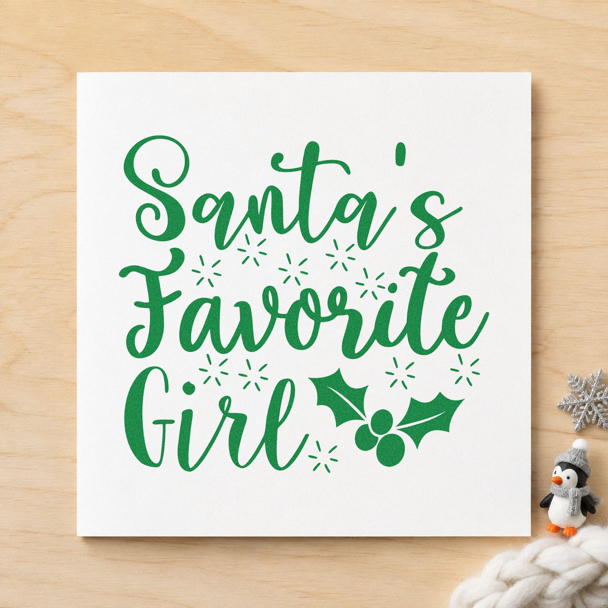 Santa's Favorite Girl Holly craft stamp imprint in green ink on a handmade project, one idea being hair bow gift tags.