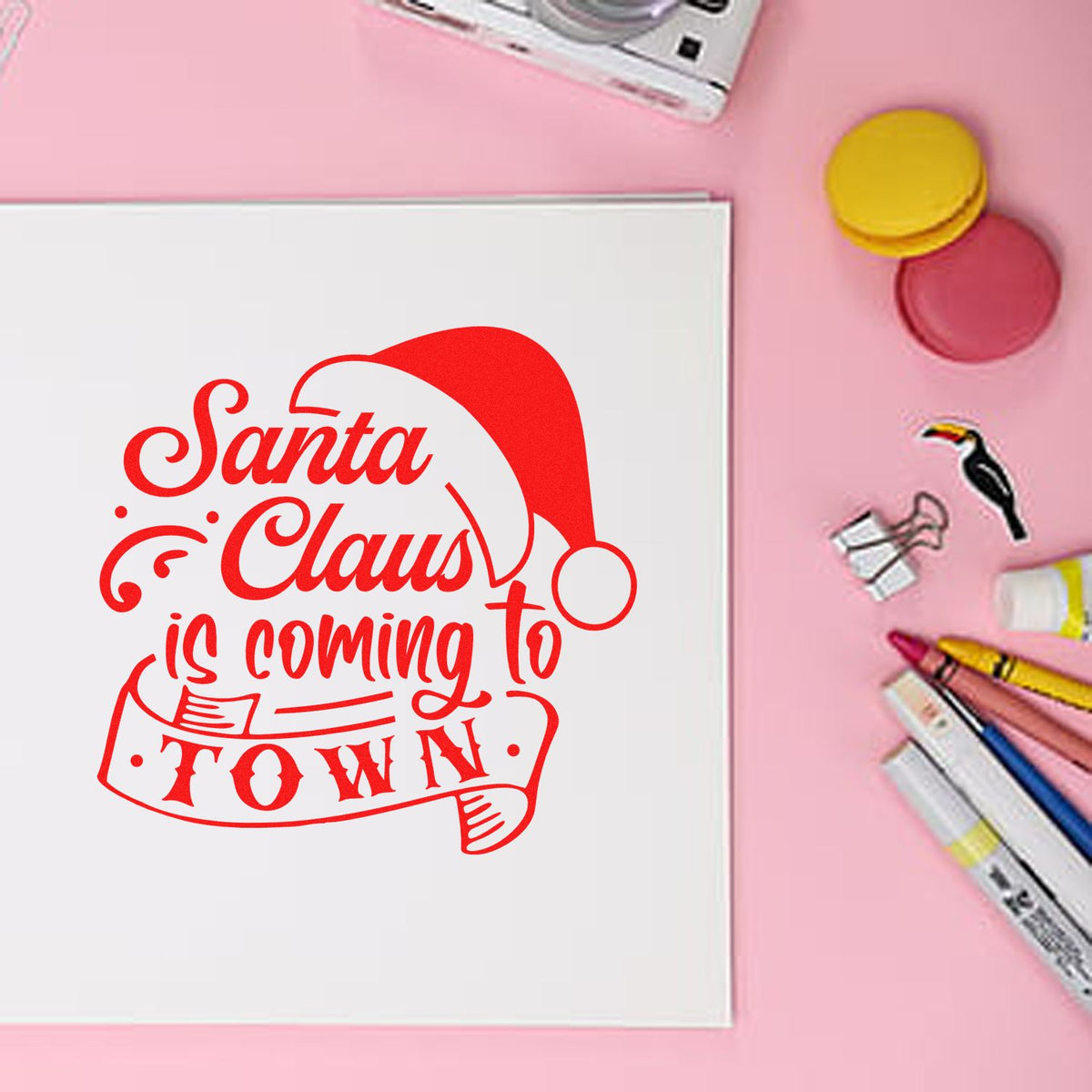 Santa Claus Coming To Town rubber stamp shown in red ink, stamped for projects such as event album page.
