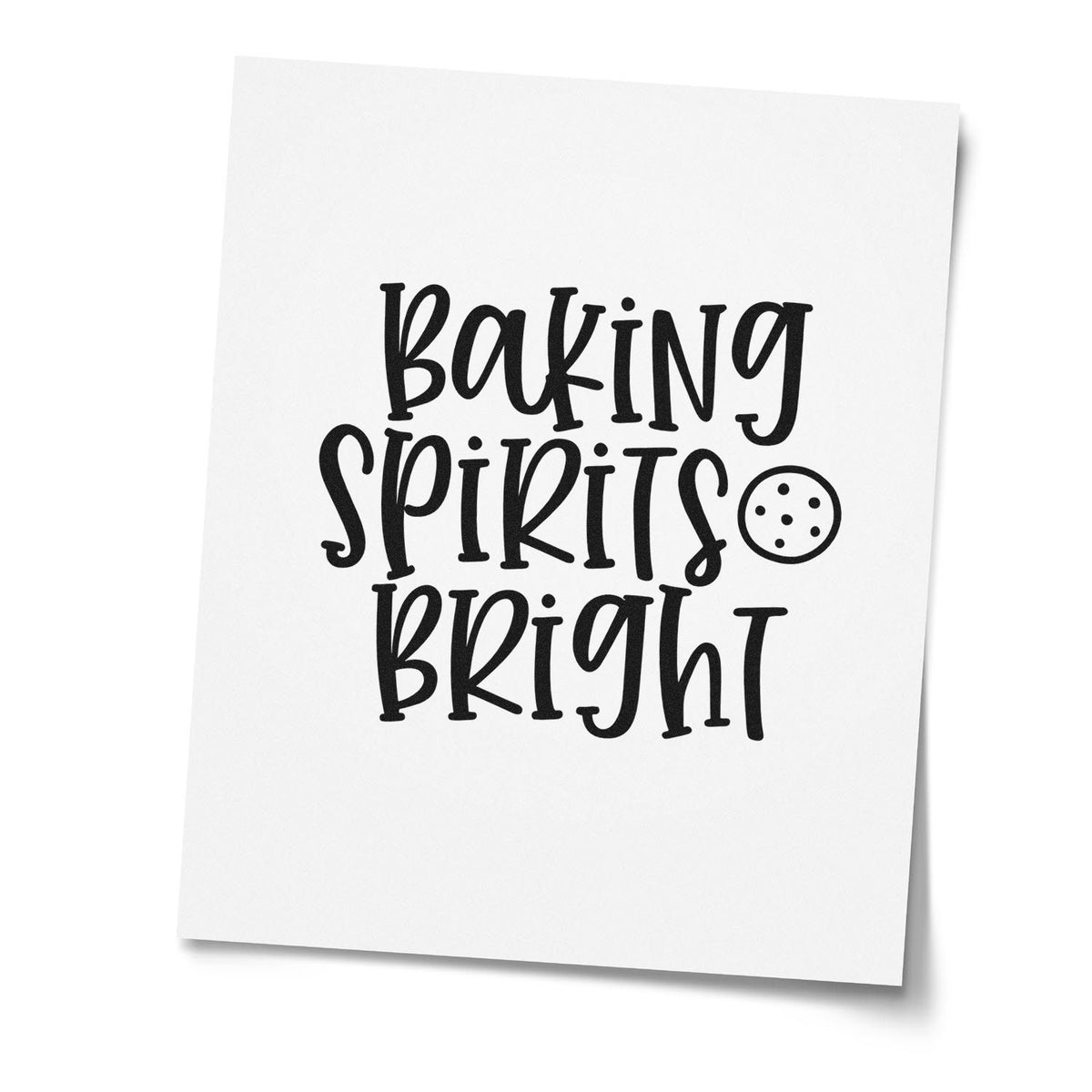 Cookie And Baking Spirits Bright PSI Pre-Inked Stamp imprint stamped in black ink. The words "Baking spirits bright" appear beside a round chocolate-chip cookie.