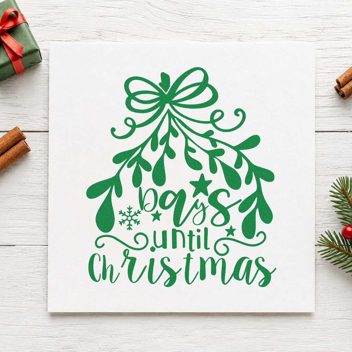 Days Until Christmas Mistletoe craft stamp imprinted in green ink on paper, a design suited to framed slate panel.