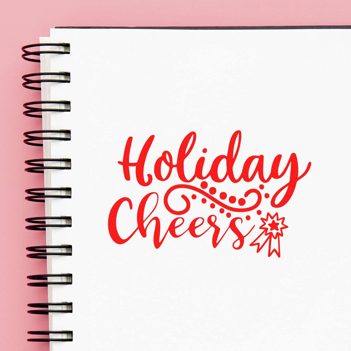 Holiday Cheers rubber stamp design in red script on a notebook page, ideal for festive card making.
