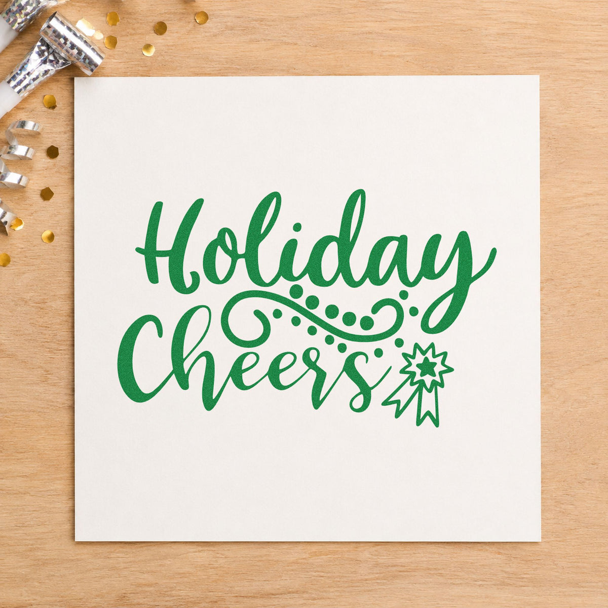 Holiday Cheers Starburst Flourish craft stamp imprint in green ink on a handmade project, one idea being place marker cards.