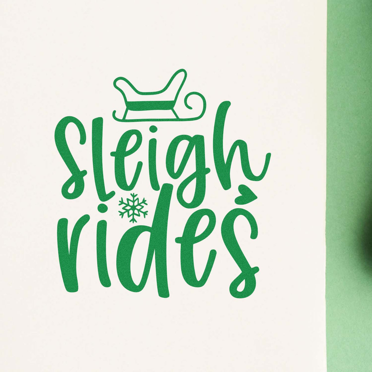 Green sleigh rides holiday rubber stamp design with sleigh icon and snowflake for Christmas crafts.