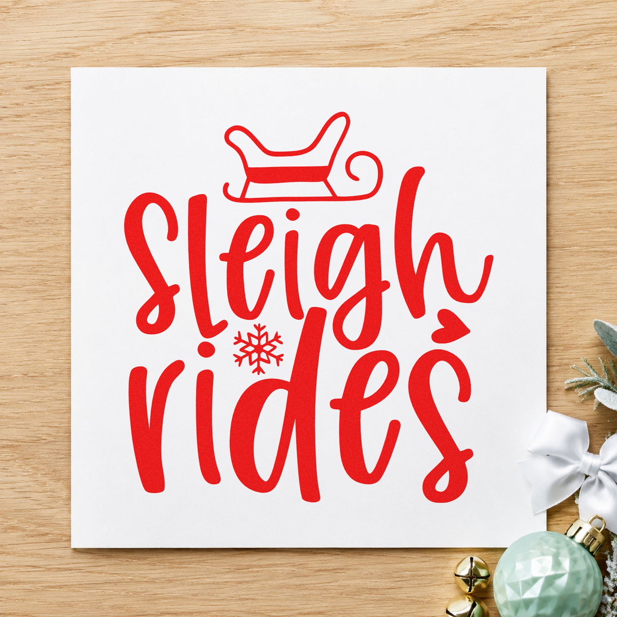 Sleigh Rides With Snowflake rubber stamp shown in red ink, stamped for projects such as rental bin labels.