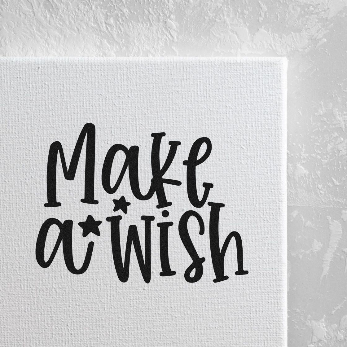 Make a Wish rubber stamp design in bold black script on white canvas for handmade cards, crafts, and birthday projects.