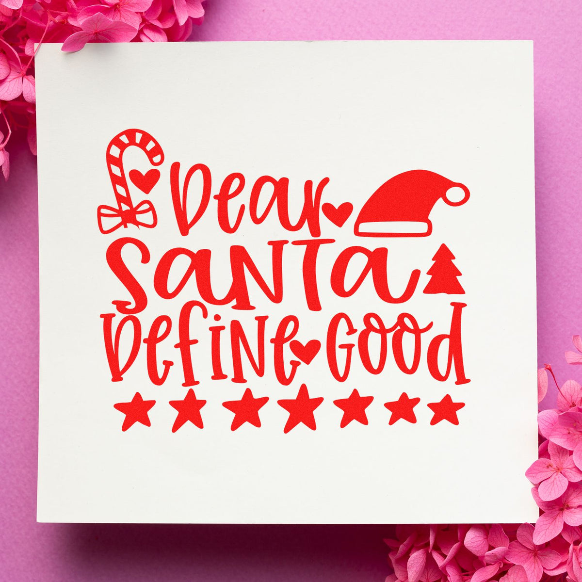 Festive Christmas rubber stamp design reading Dear Santa Define Good with candy cane, Santa hat, tree and stars.