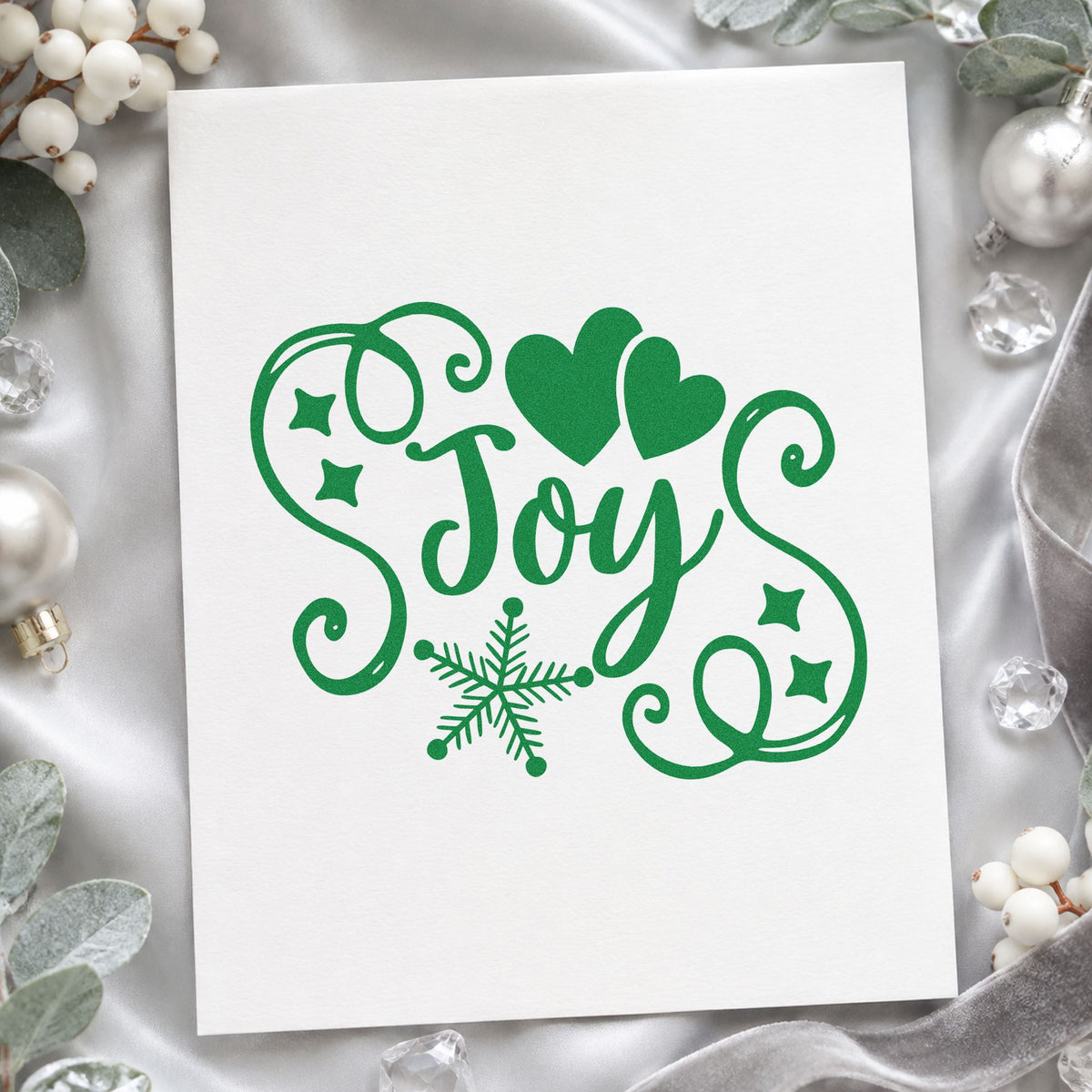 Joy Hearts Snowflake Flourish craft stamp imprint in green ink on a handmade project, one idea being charity thank cards.