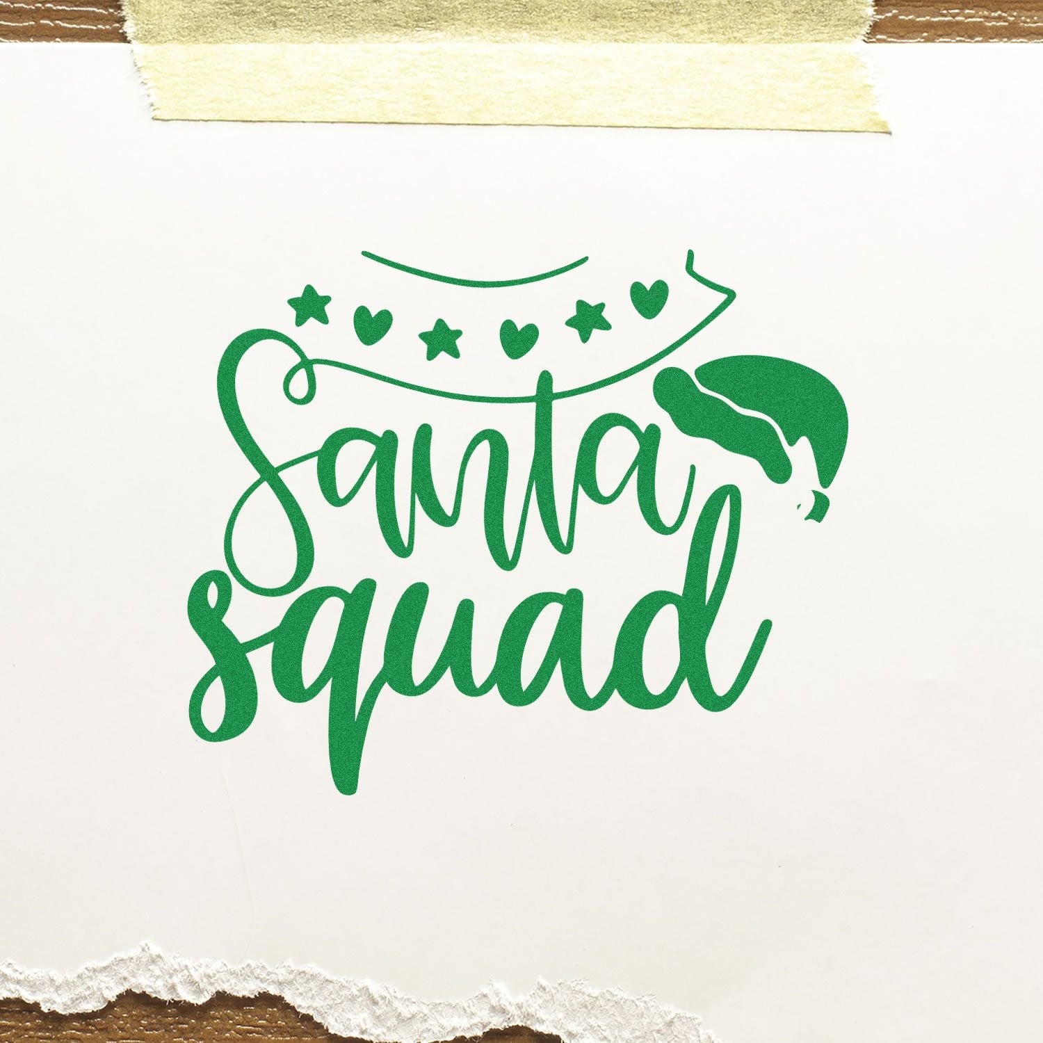 Green Santa Squad holiday rubber stamp design with Santa hat, stars and hearts on white paper.