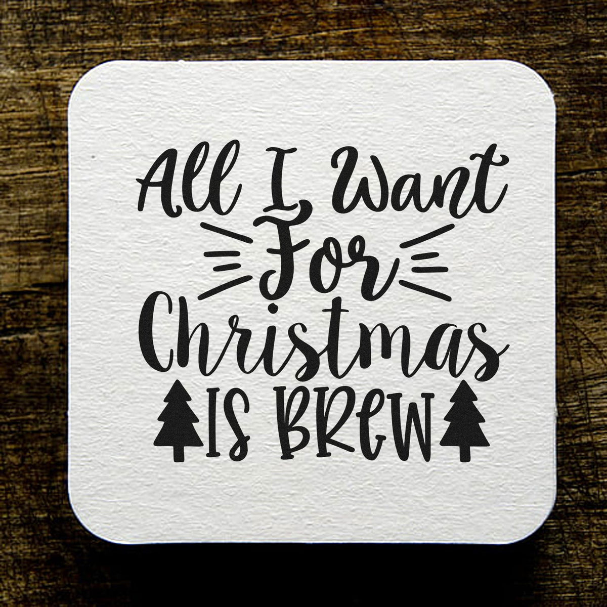 All I Want For Christmas Is Brew PSI Pre-Inked Stamp imprint stamped in black ink. The phrase "All I want for Christmas is brew" includes two small Christmas trees and emphasis lines.