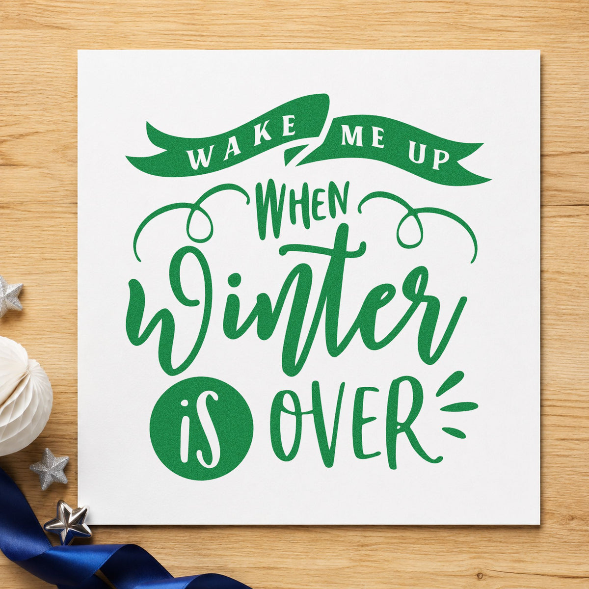 Wake Me When Winter Ends craft stamp imprint in green ink on a handmade project, one idea being flight day cards.