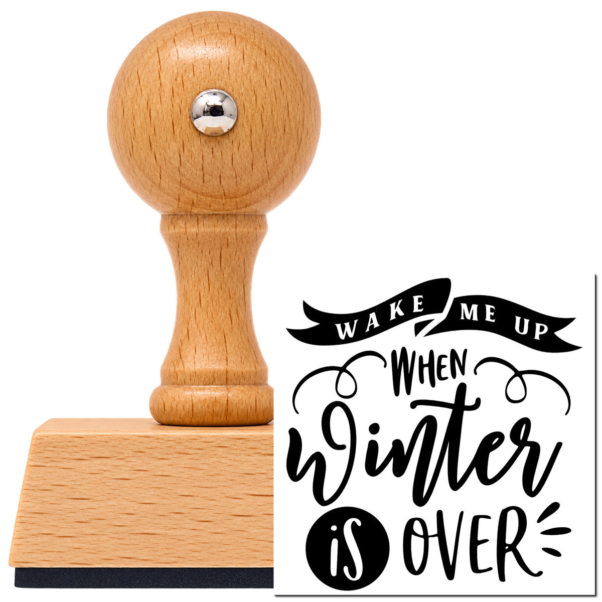 Wake Me When Winter Ends Vintage Pro rubber stamp in European beech wood with a round knob handle, shown beside its black imprint.