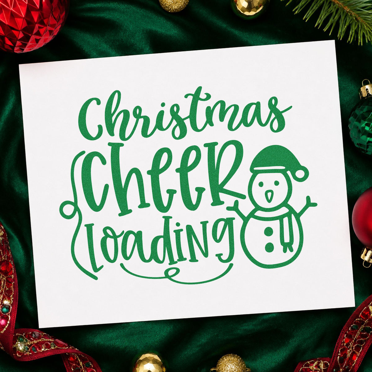 Christmas Cheer Loading Snowman craft stamp imprint in green ink on a handmade project, one idea being sticker chart cards.