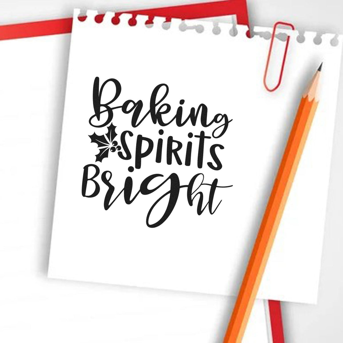 Holiday baking rubber stamp with Baking Spirits Bright and holly accent for Christmas cards, tags, and kitchen crafts.