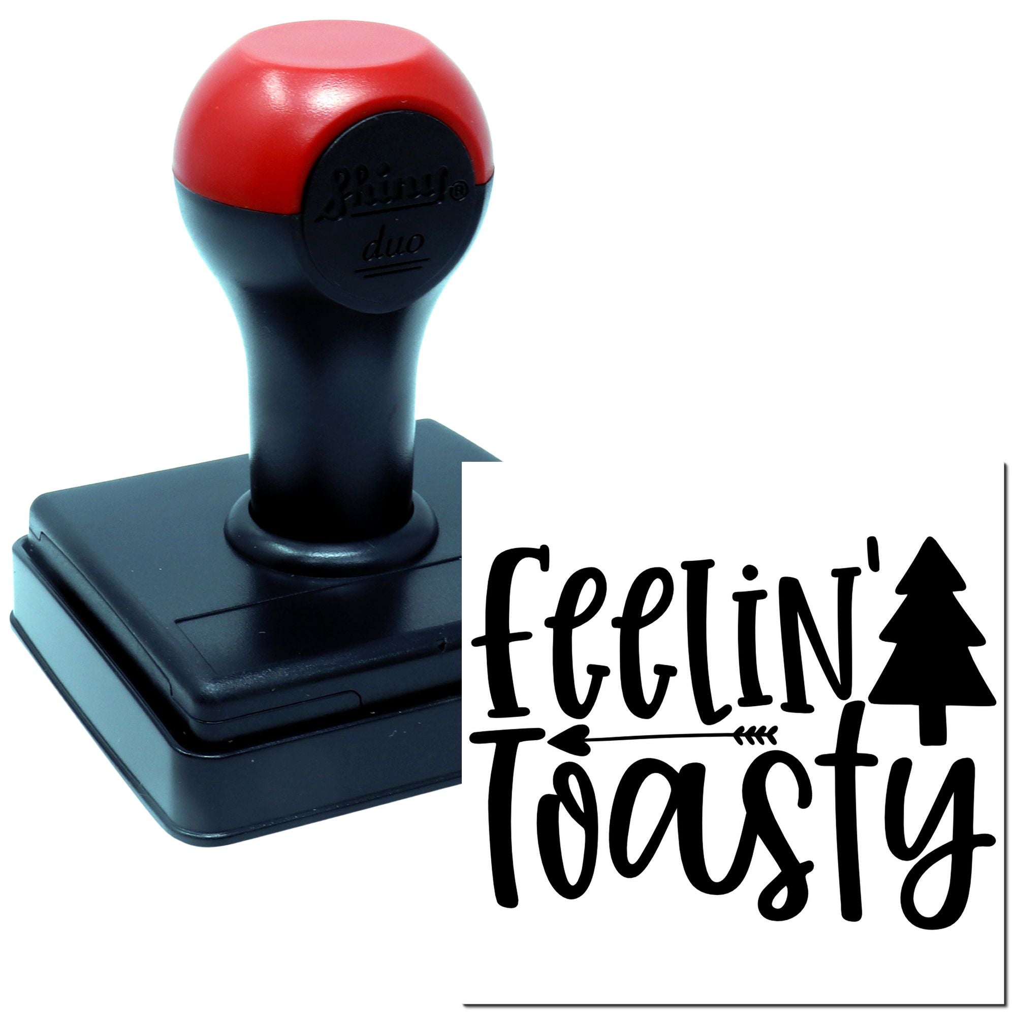 Self-inking rubber stamp with feelin toasty holiday design and pine tree icon for custom crafting.