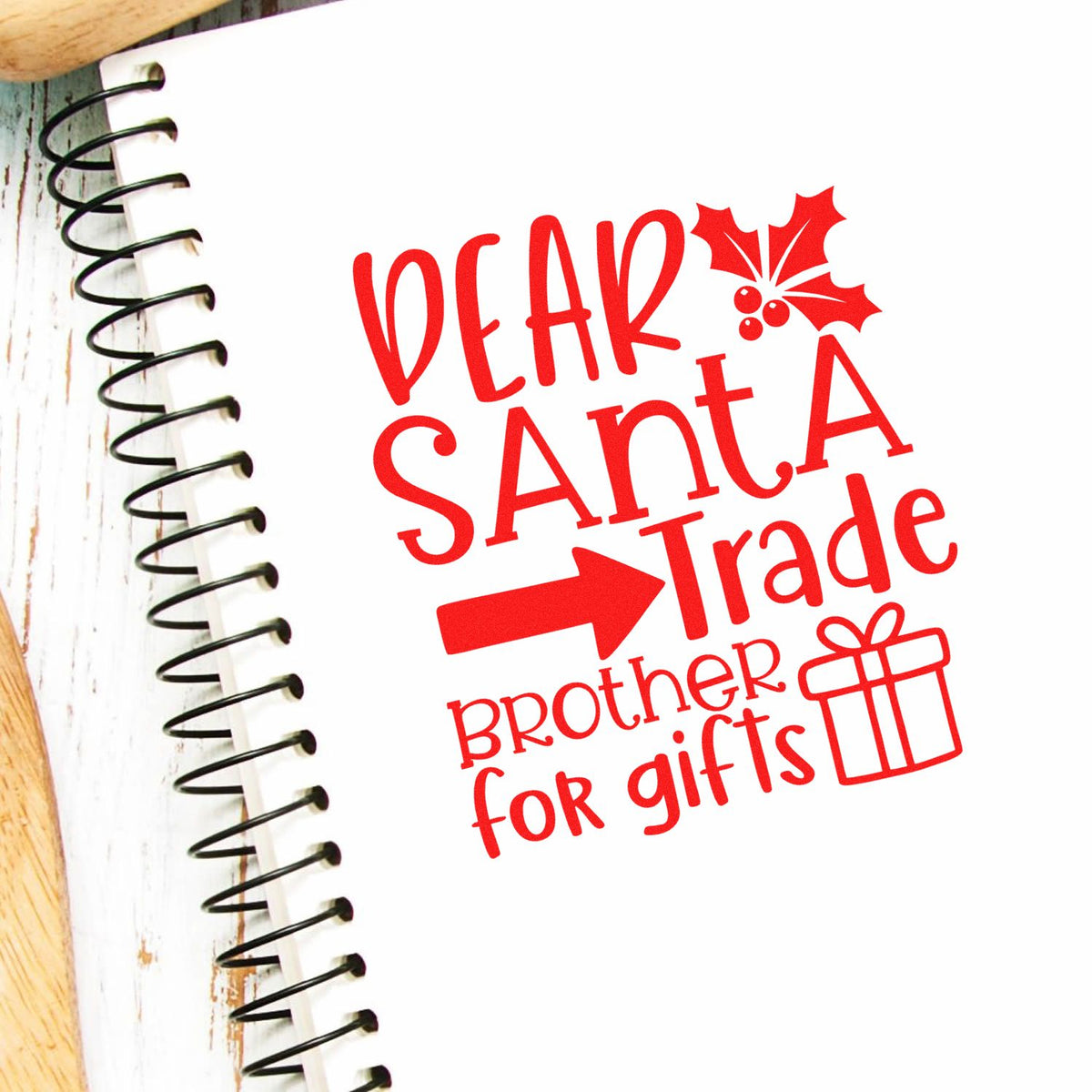 Christmas rubber stamp design with Dear Santa Trade Brother for Gifts, holly, and gift icon for holiday cards and crafts.