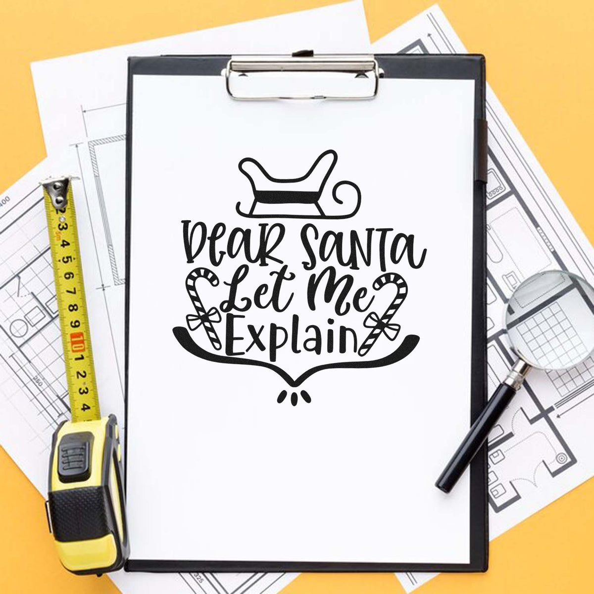 Custom holiday rubber stamp design reading Dear Santa Let Me Explain with sleigh and candy canes on a clipboard mockup.