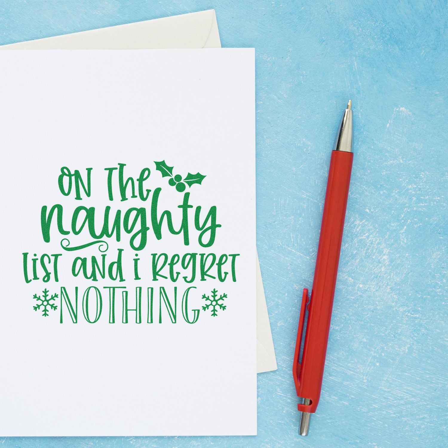 Holiday rubber stamp design with On the naughty list and I regret nothing for Christmas cards, scrapbooks, and festive crafts.