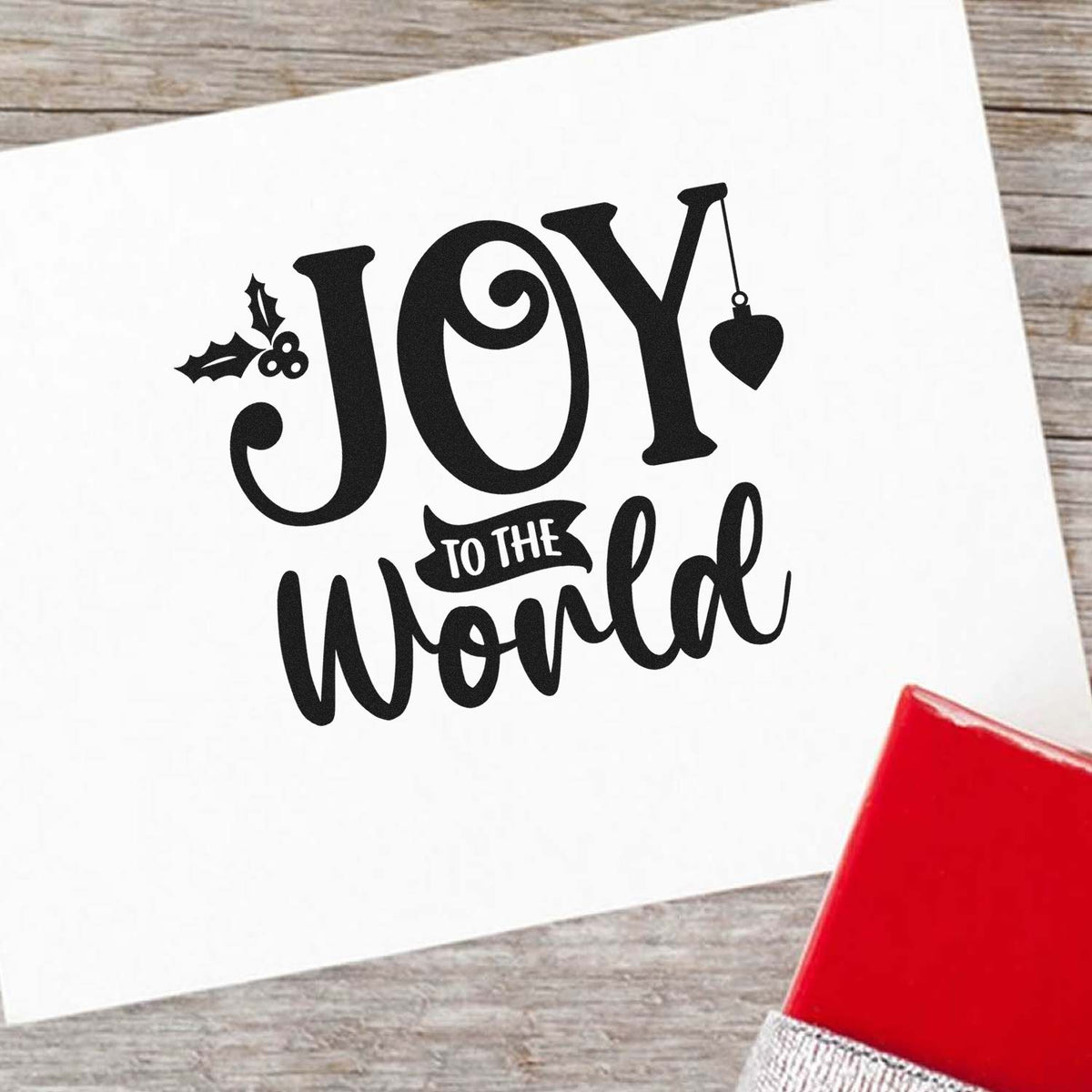 Joy to the World Christmas rubber stamp design with holly and ornament accents for holiday cards and crafts.