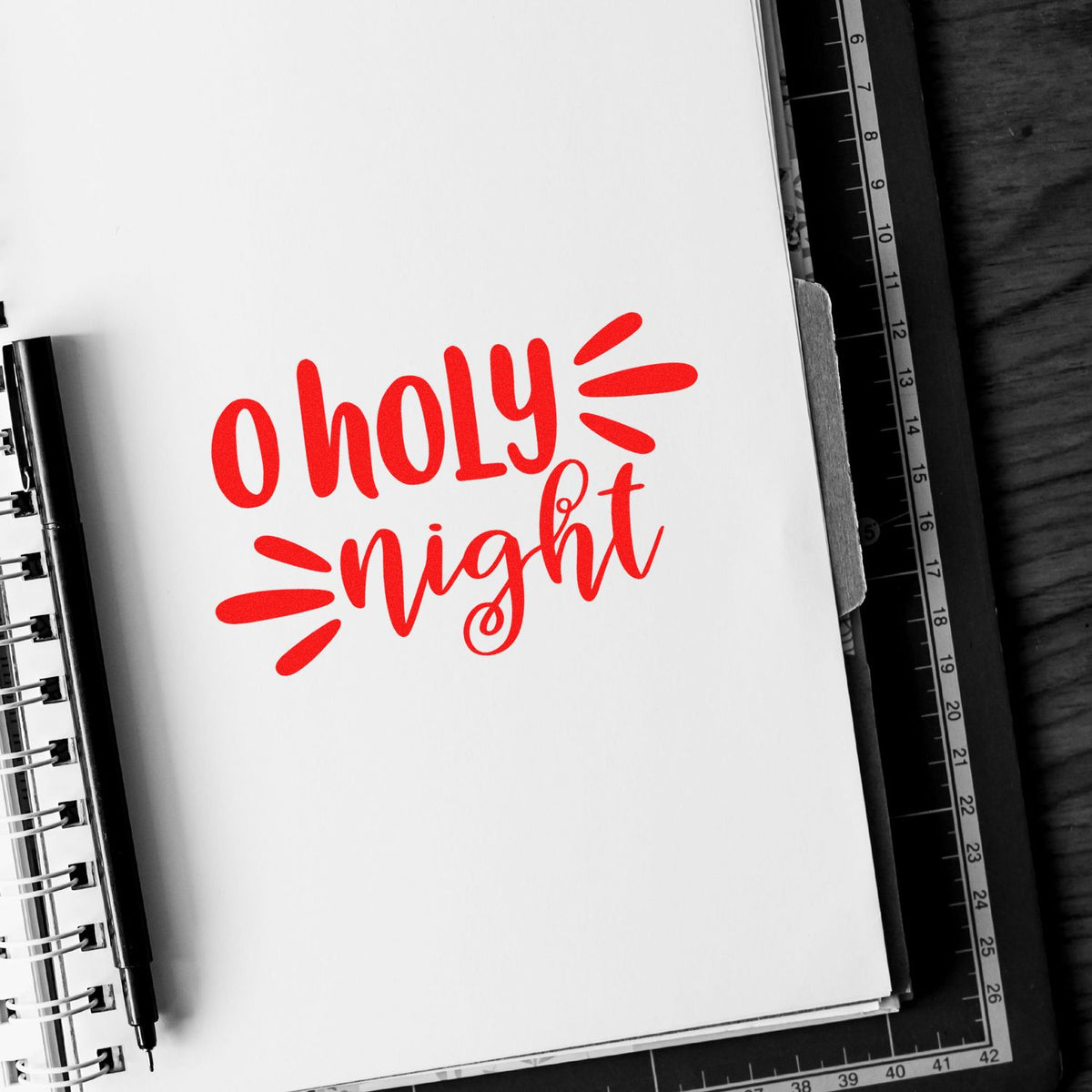 Red O Holy Night rubber stamp design on notebook page for Christmas cards, holiday crafts, and seasonal papercrafting.