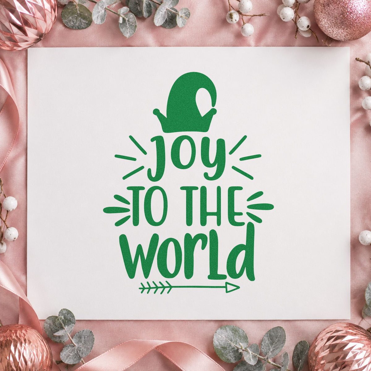Joy To The World Mitten craft stamp imprinted in green ink on paper, a design suited to framed mudroom hook.
