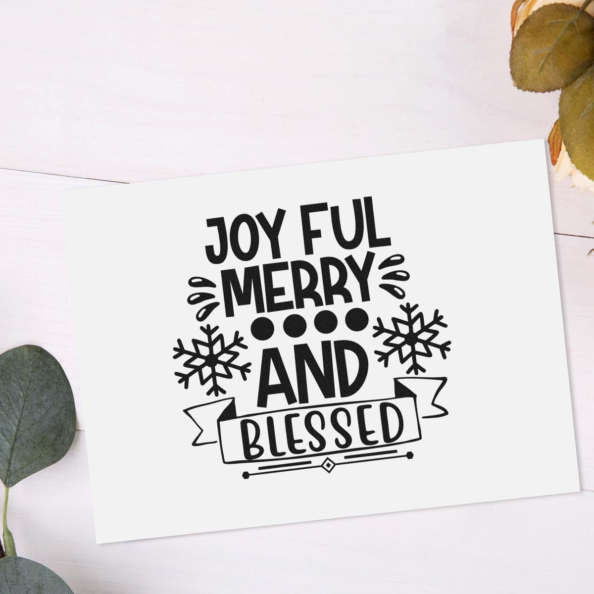 Christmas rubber stamp design with Joyful Merry and Blessed text, snowflakes, and banner for holiday card making.