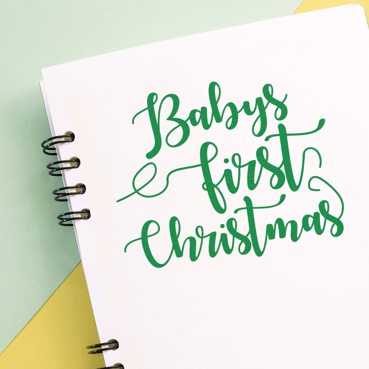 Babys First Christmas rubber stamp in green script, perfect for holiday cards, scrapbook pages, and baby keepsake crafts.