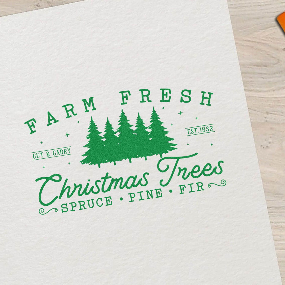 Green Farm Fresh Christmas Trees rubber stamp design with pine trees, Cut & Carry, and Est. 1932 on white paper.