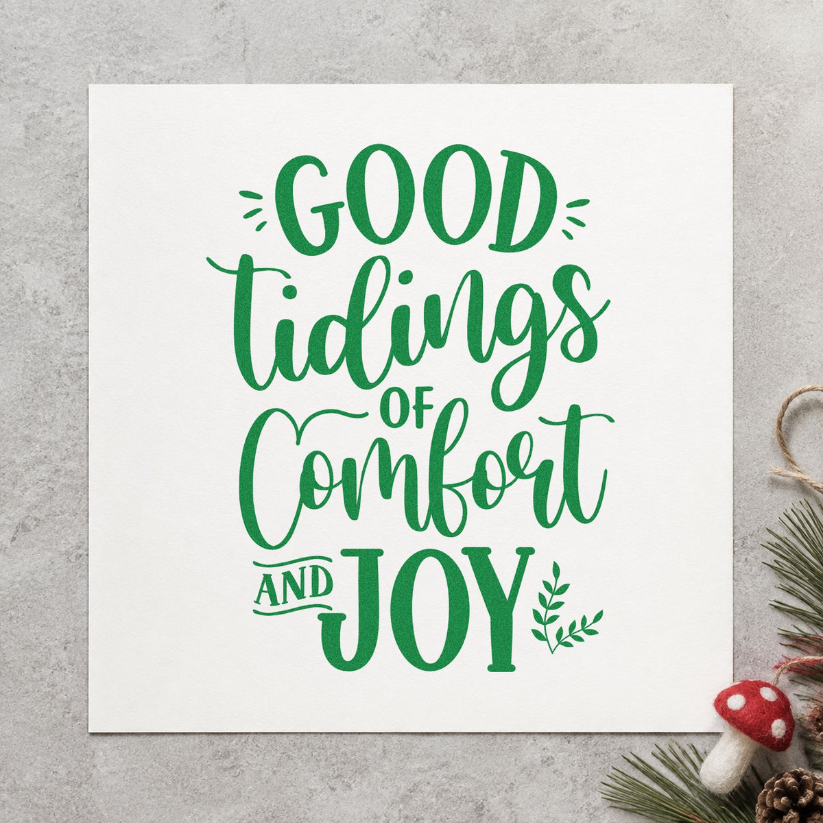 Good Tidings Comfort And Joy craft stamp imprint in green ink on a handmade project, one idea being encouragement cards.
