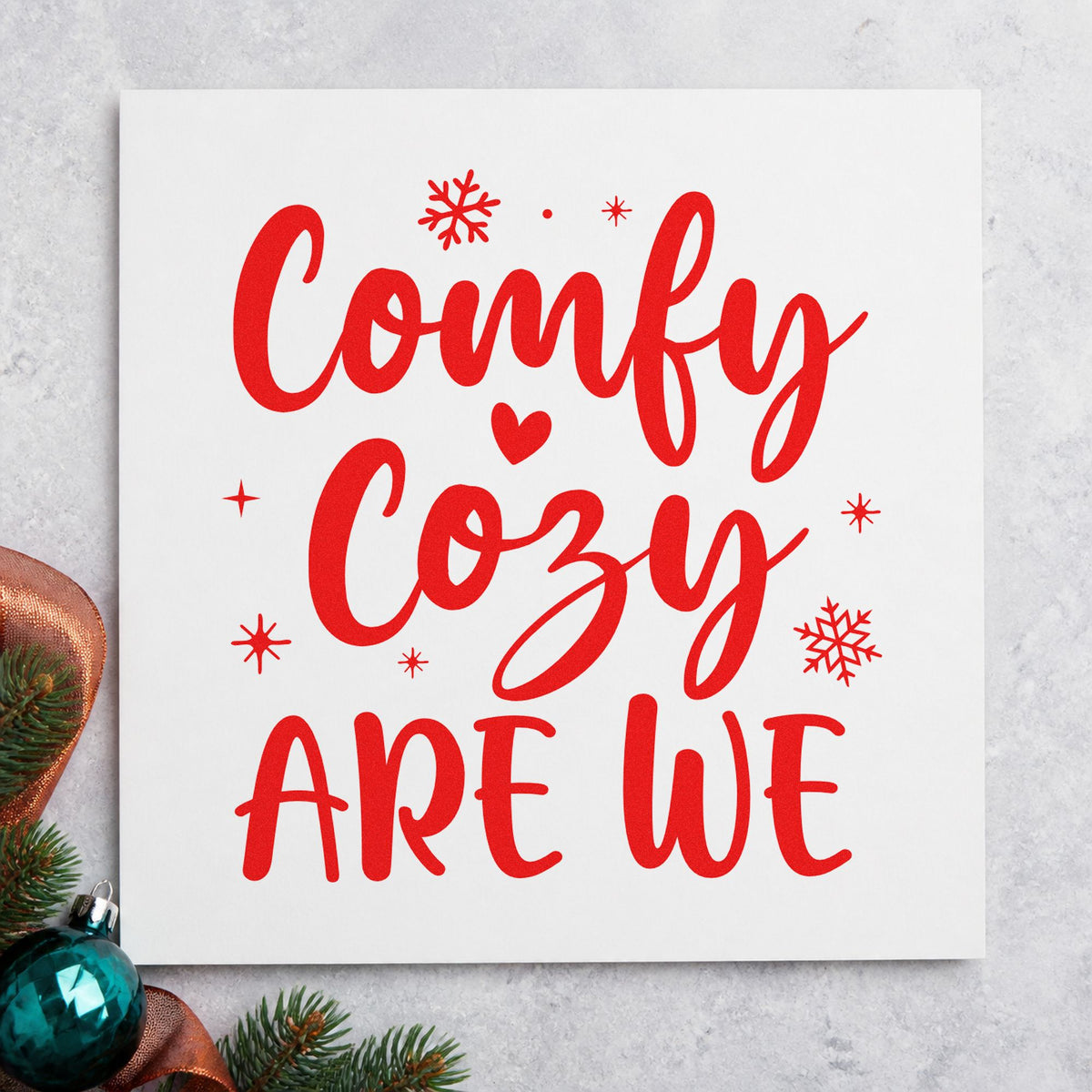 Comfy Cozy Are We craft stamp in red ink on cardstock, an easy option for fleece throw printing.