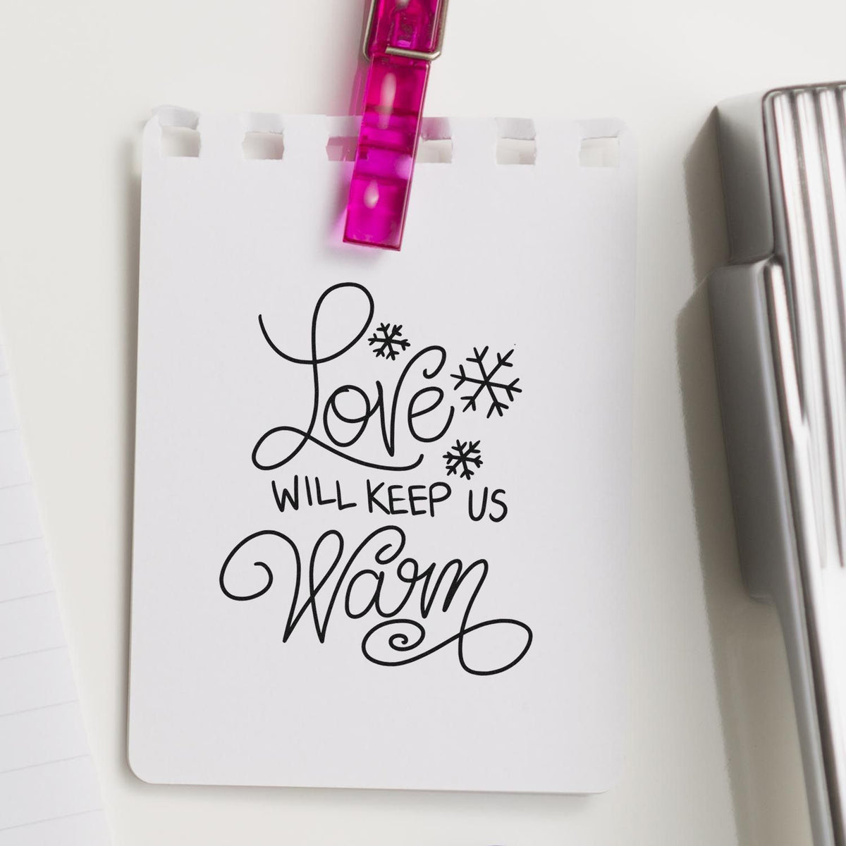 Love Will Keep Us Warm rubber stamp design on white paper, ideal for winter cards, handmade stationery, and craft projects.