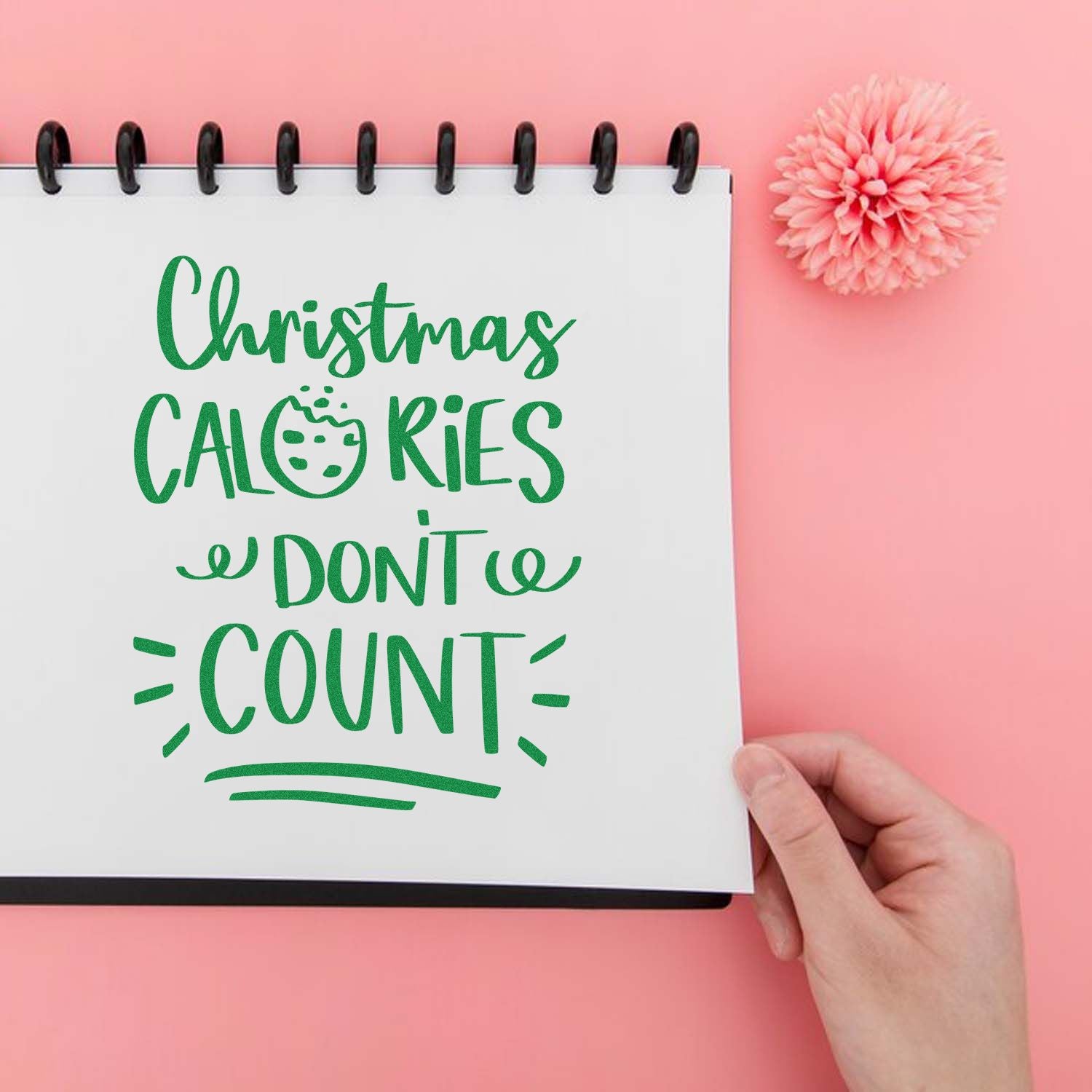 Christmas calories don't count rubber stamp design on notebook, ideal for holiday baking and festive craft projects.