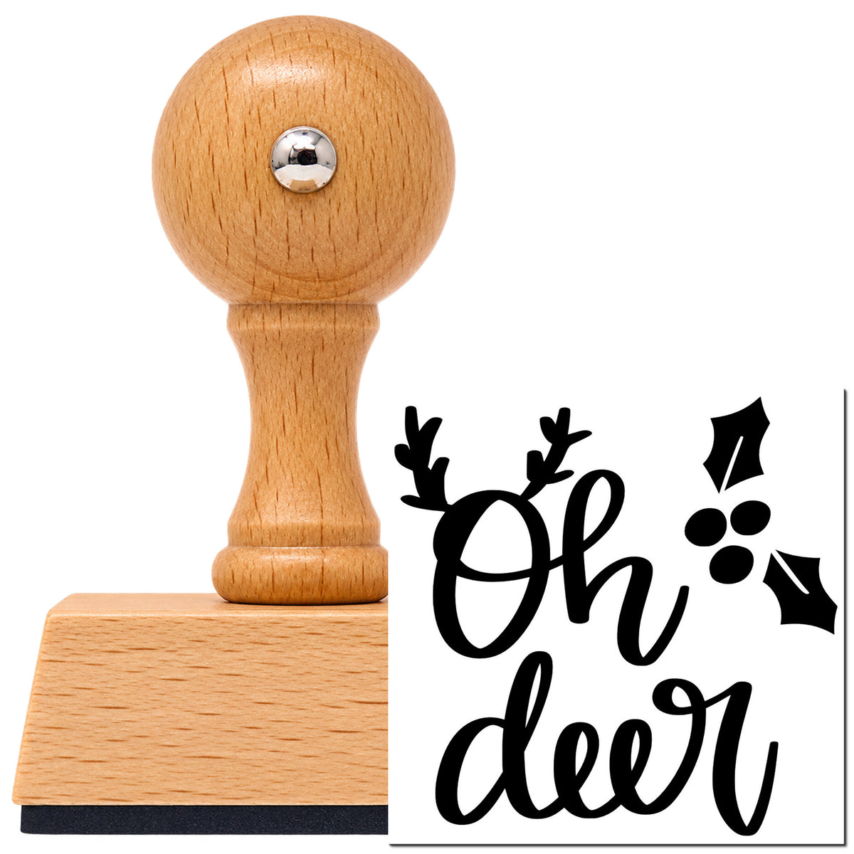 Oh Deer Holly Antlers Vintage Pro rubber stamp in European beech wood with a round knob handle, shown beside its black imprint.
