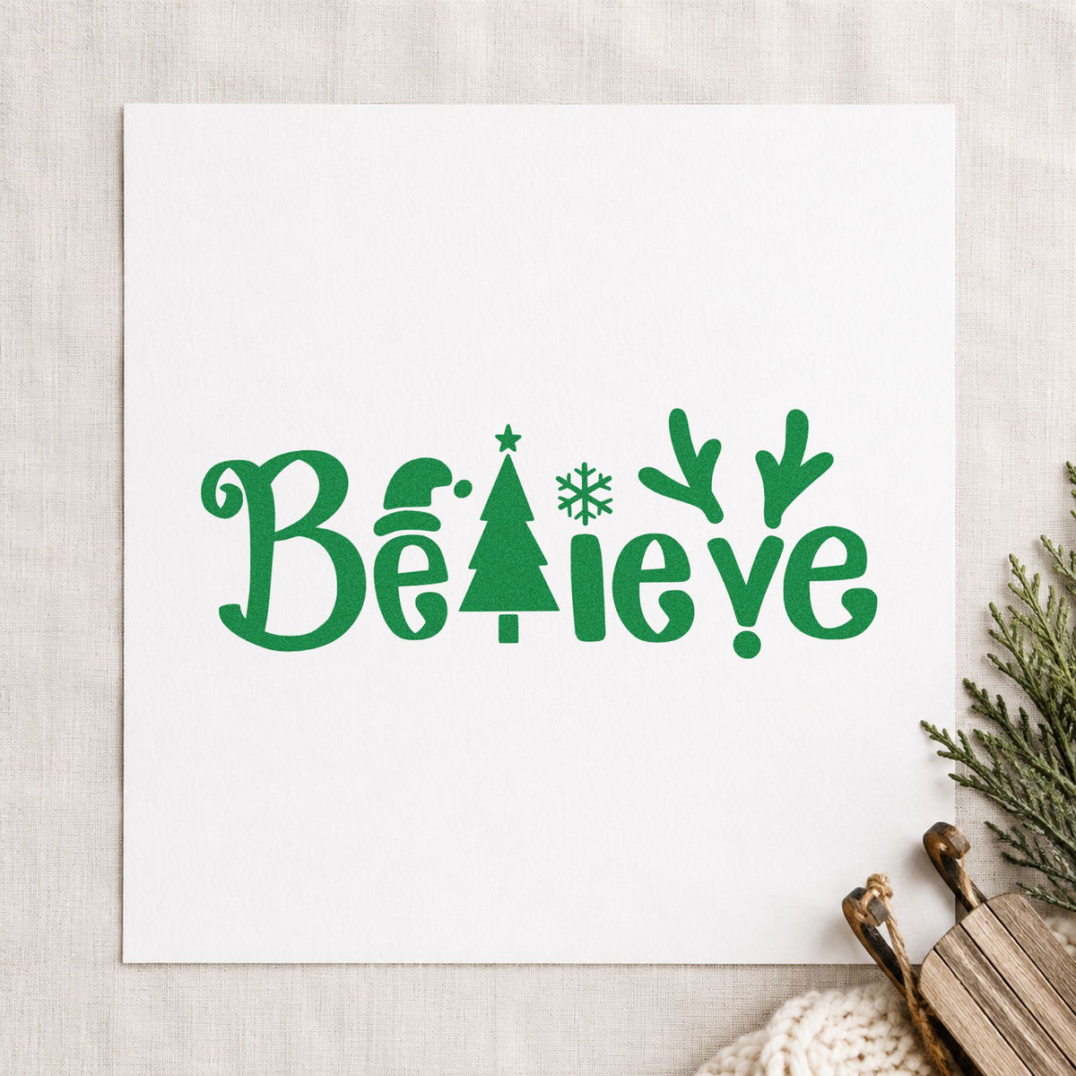 Believe Holiday Lettering Icons craft stamp imprinted in green ink on paper, a design suited to framed close study.