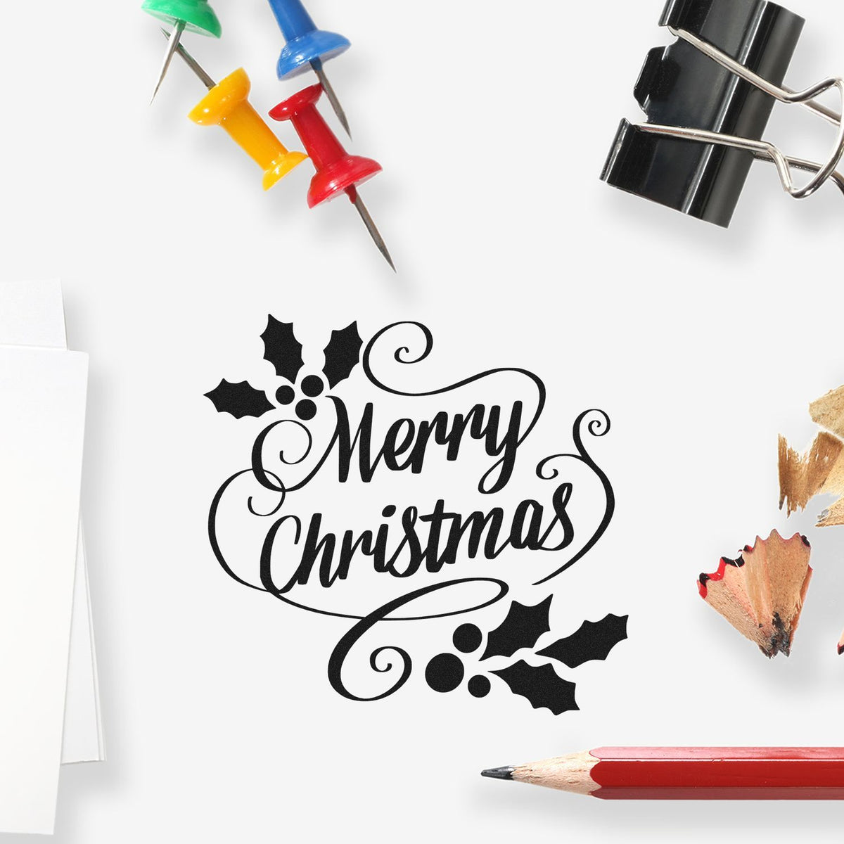 Merry Christmas rubber stamp design with holly, ideal for holiday cards, crafts, and packaging.