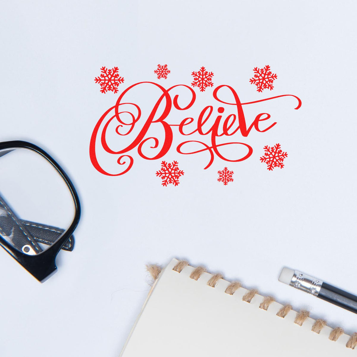 Holiday rubber stamp design with Believe and snowflakes, perfect for Christmas cards and festive stationery.