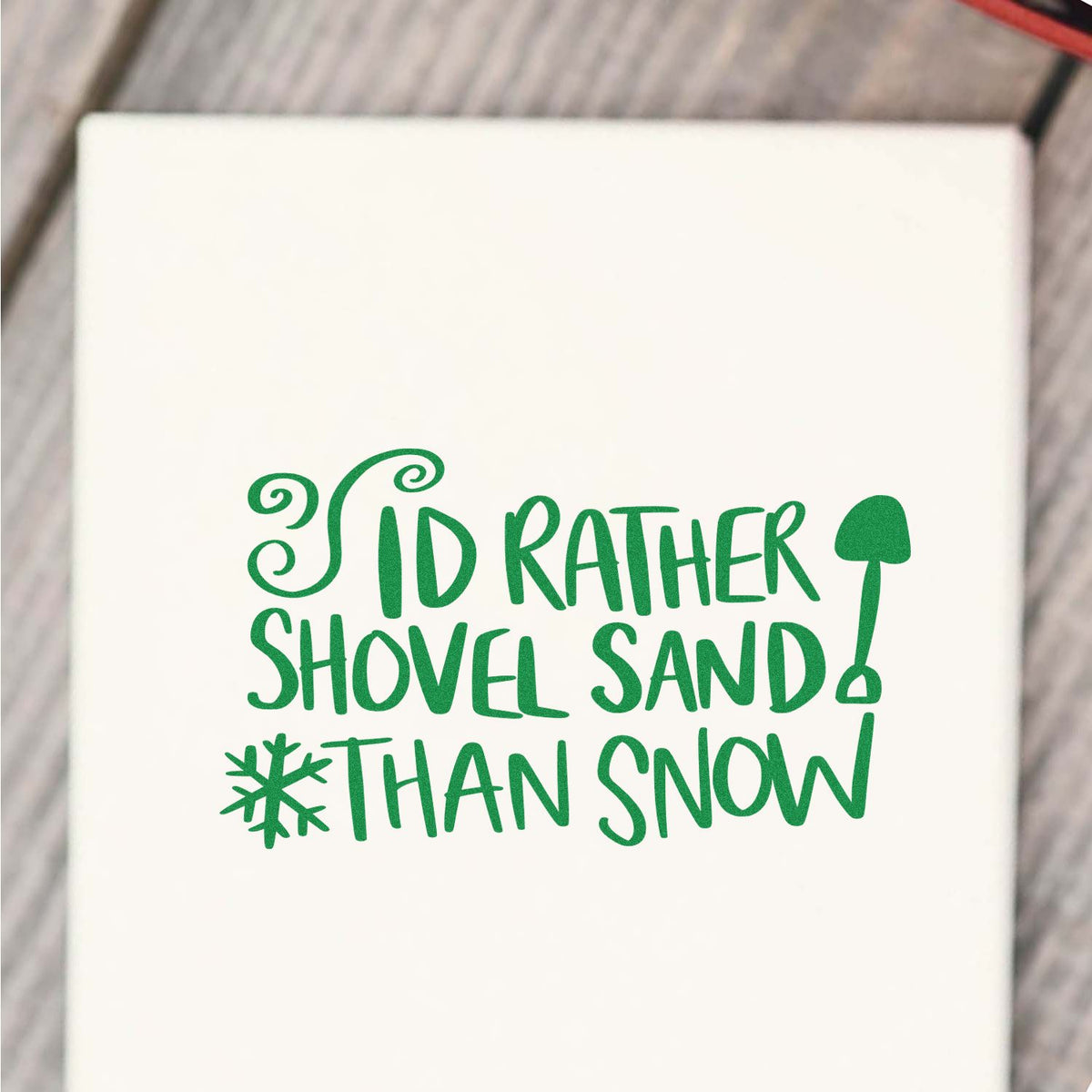 Rather Shovel Sand Than Snow rubber stamp shown in green ink, stamped for projects such as beach trip album.