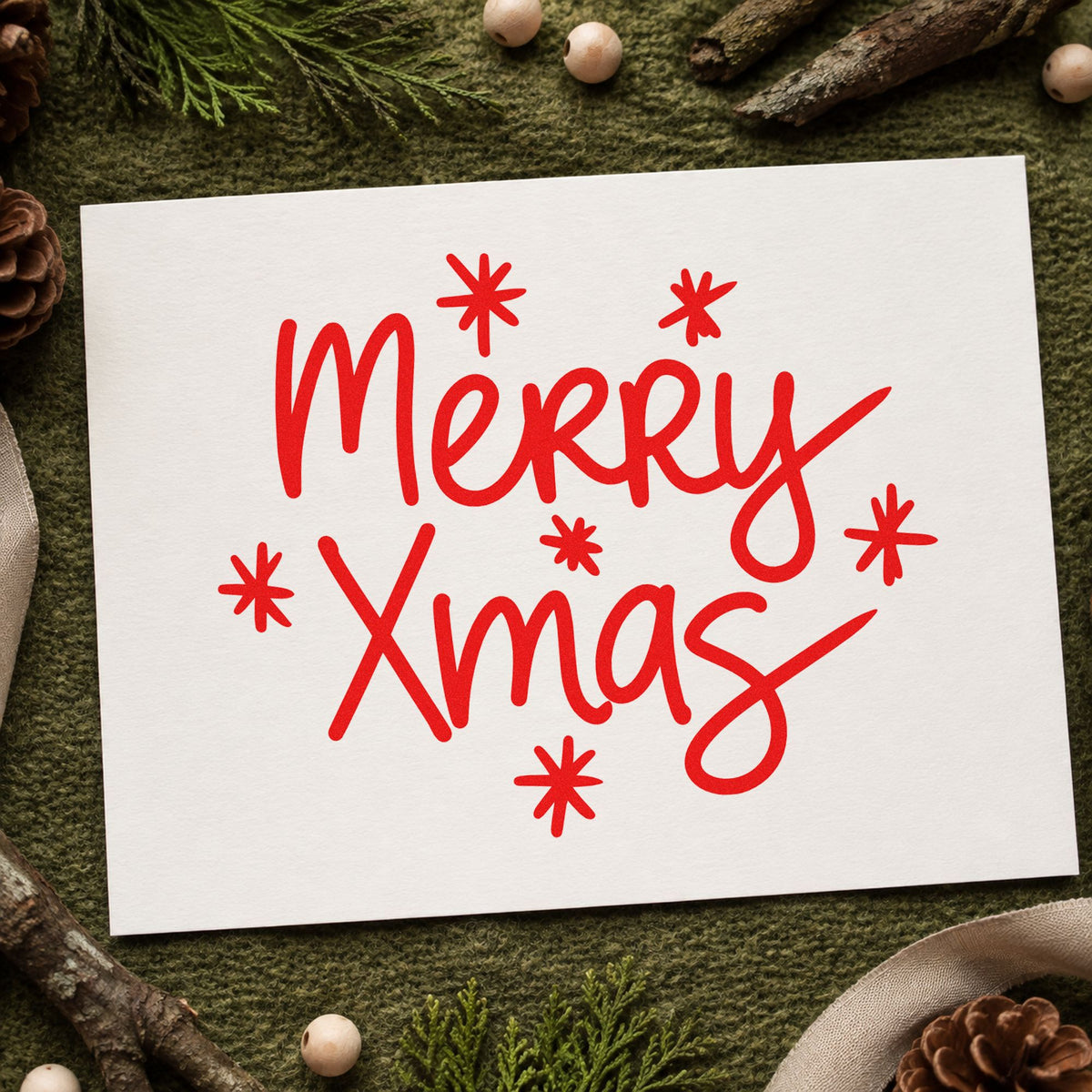 Merry Xmas Starbursts craft stamp in red ink on cardstock, an easy option for tote fast printing.