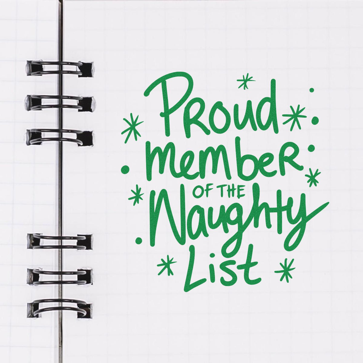 Proud Naughty List Member rubber stamp shown in green ink, stamped for projects such as group album page.